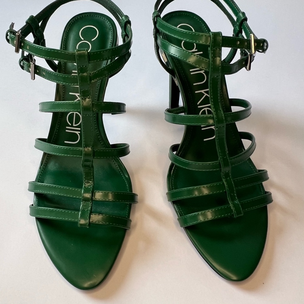 Calvin Klein size 9 strappy, green heels with silver accents.